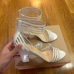 Size 39.5 never worn before Christian louboutin white sandals.
